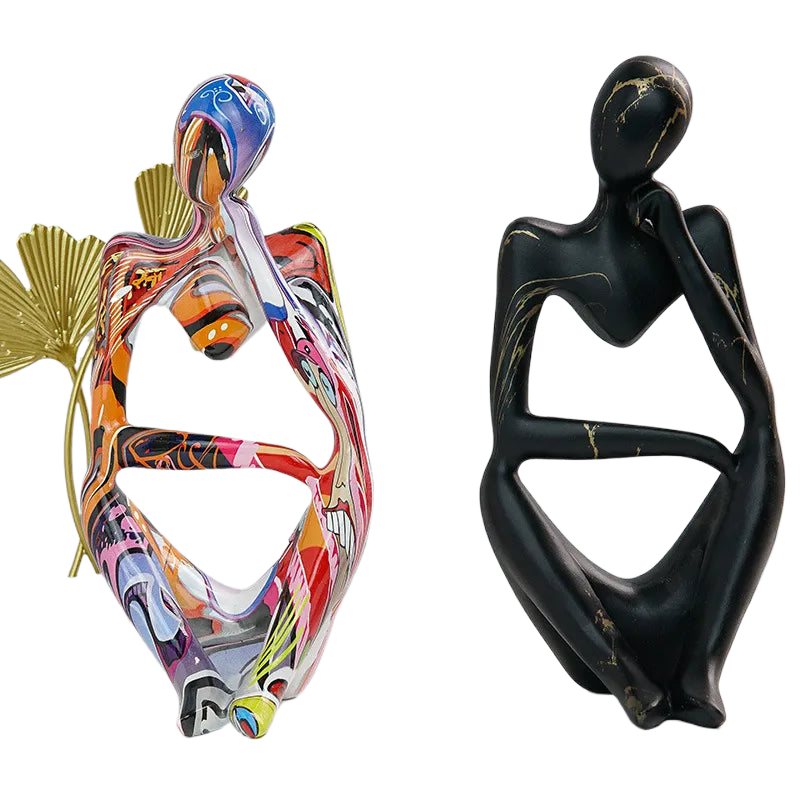 Two Abstrakte Denker Skulptur pieces displaying graffiti and marble finish options