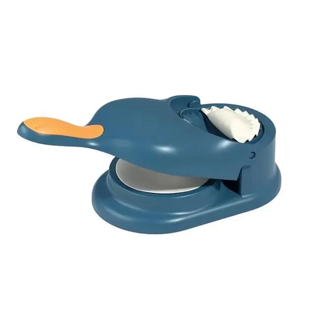 Single blue 2-in-1 Knödel Teigtaschenformer with formed dumpling on white background