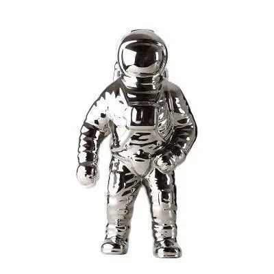 Shiny chrome astronauten-figur planter reflecting light creative space decoration