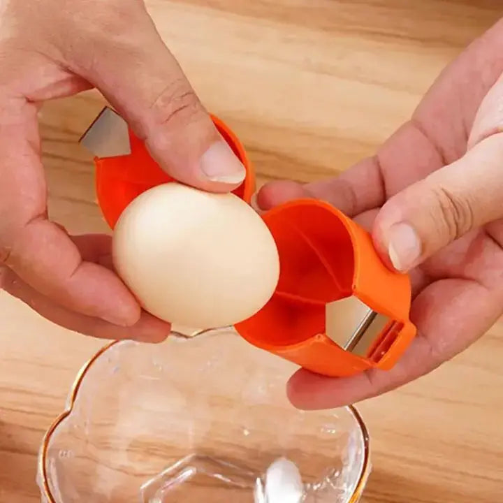 White egg being cracked with 2in1 Eieröffner Eigelbtrenner over glass bowl