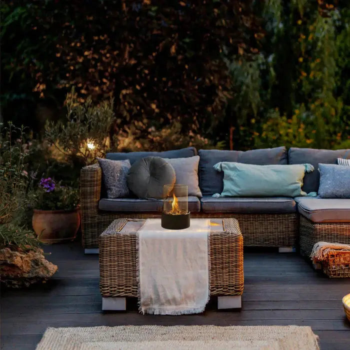 Tischfeuer-Laterne creating atmosphere on outdoor patio coffee table